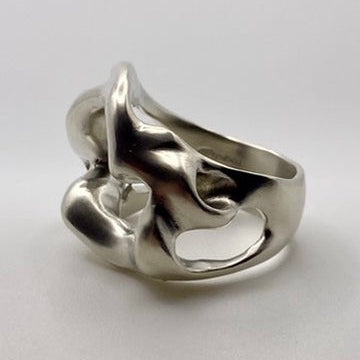 Silver ring with a unique design on a white background