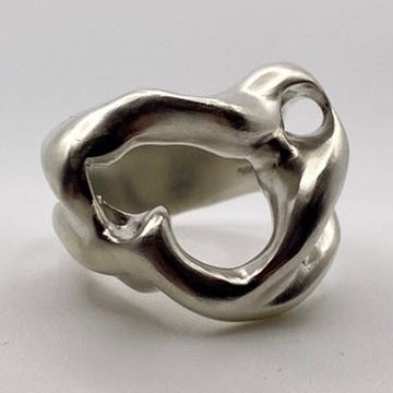 Silver ring with a unique design on a light gray background