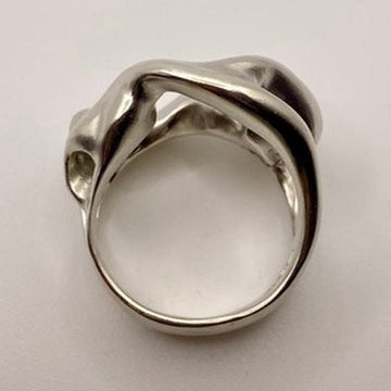Silver ring on a light gray background