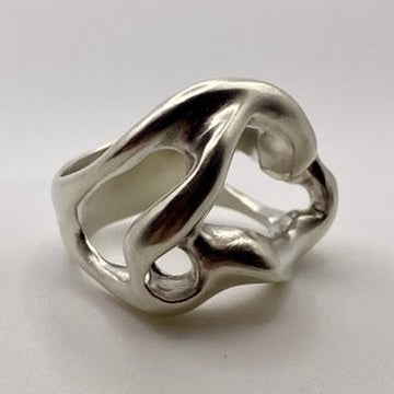 Silver ring with a unique design on a white background