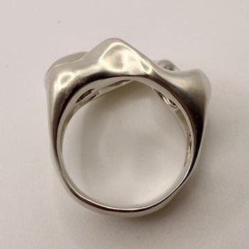 Silver ring on a light gray background