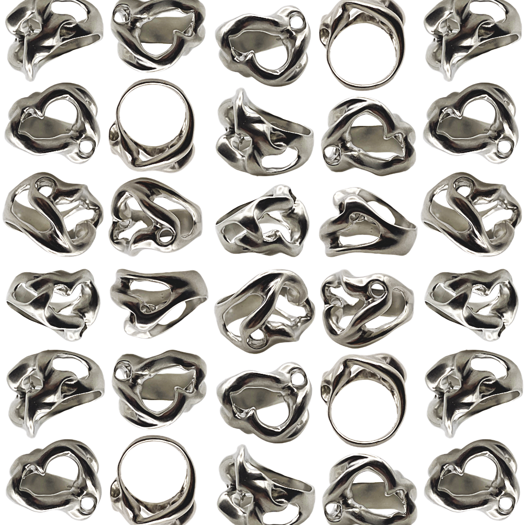 Collection of silver rings on a white background