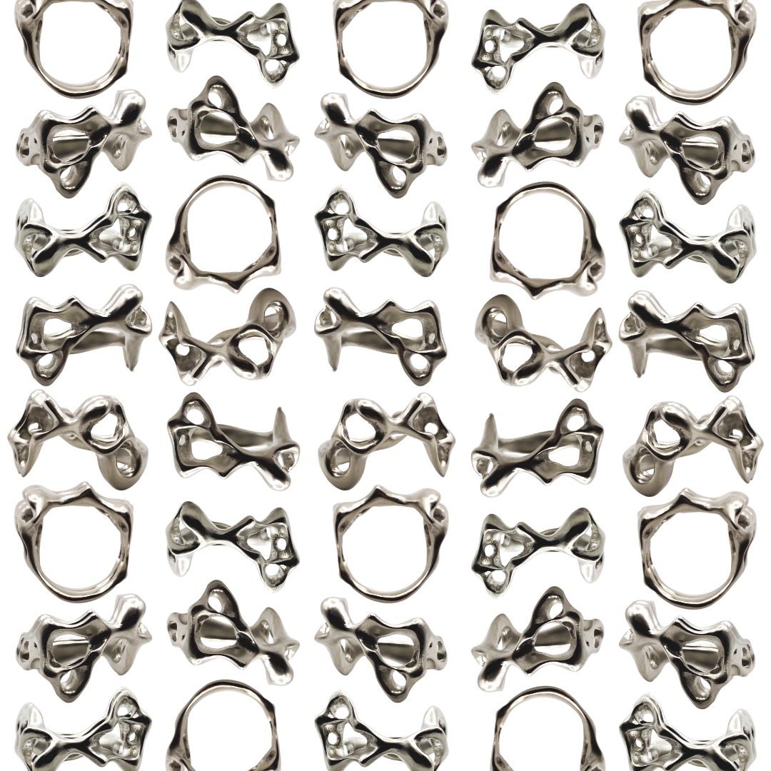 Pattern of metallic orgaic-shaped rings on a white background