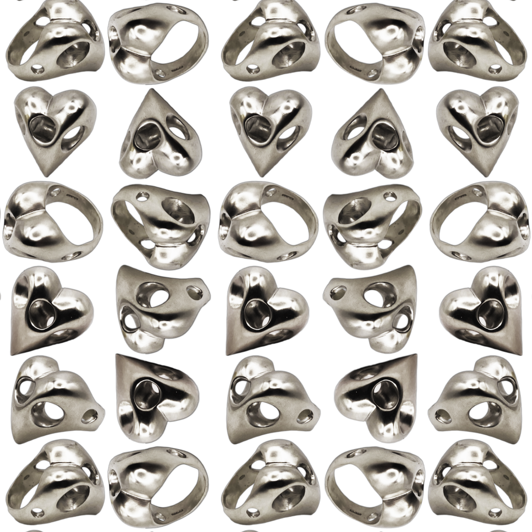 Pattern of metallic heart-shaped rings objects on a white background